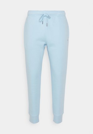Light blue fleece sweatpants with an elastic waistband and adjustable drawstring. Cuffs taper at the ankle. Minimal branding on the side.