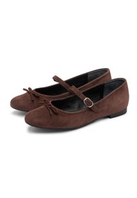 Brown suede ballet flats with a rounded toe, a decorative bow, and an ankle strap with a metal buckle. Flat rubber sole and black inner lining.