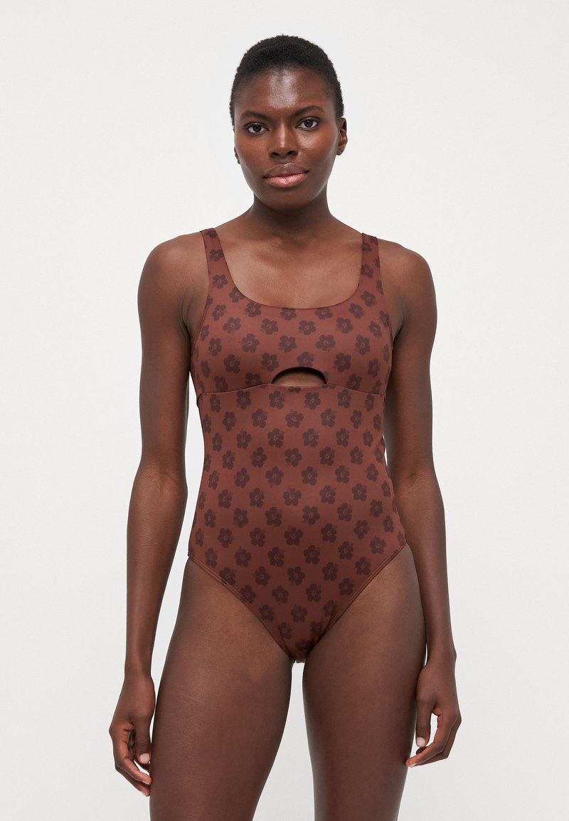 Brown floral patterned swimsuit with a square neckline and cut-out detail. Made from smooth fabric with a fitted design and wide straps.
