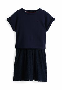 Vestido azul marino con un top de manga corta y una falda de encaje con motivos florales. Tejido suave con un escote redondo y mangas enrolladas.