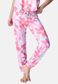 Pantalon de détente en polaire rose et bleu clair avec un motif floral, doté d'une taille élastique, de poignets élastiqués et d'un cordon de serrage.