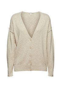 Cardigan beige con scollatura a V profonda, maniche lunghe e sei grandi bottoni lungo la parte anteriore. Realizzato in un morbido materiale lavorato a maglia.