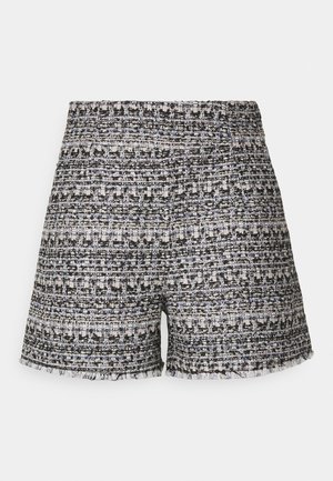 Shorts en tweed tissé avec taille élastique, présentant un motif noir, blanc et bleu. Détails d'ourlet effiloché sur les bords inférieurs.