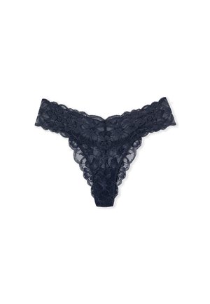 Navy blue lace thong with floral patterns and scalloped edges laid flat on a white background.