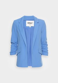 Sininen bleiseri räätälöitynä, jossa on lovetut läpät, käärityt hihat ja kaksi etutaskua. Valmistettu sileästä kankaasta.