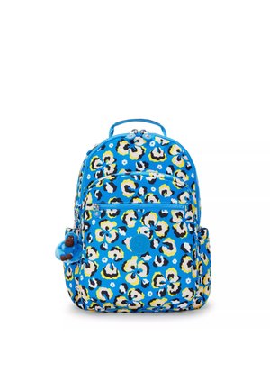 Niebieski plecak z kwiecistym wzorem pantery w kolorze żółtym, czarnym i białym. Posiada zamki błyskawiczne, uchwyt oraz breloczek w kształcie małpy.
