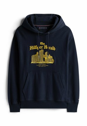 Marineblauwe hoodie van katoen. Bevat een voorzak, een trekkoordkap en gele grafische tekst/ontwerp, met ribben aan de mouwen en onderkant.