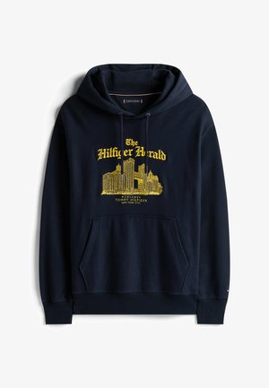 Marineblauwe hoodie van katoen. Bevat een voorzak, een trekkoordkap en gele grafische tekst/ontwerp, met ribben aan de mouwen en onderkant.