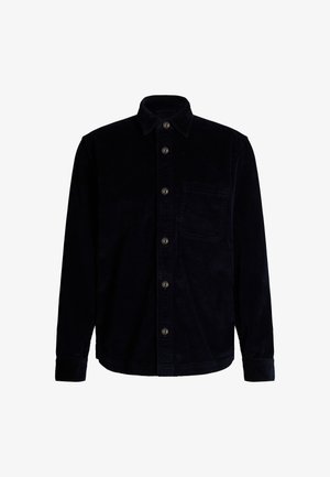 Chemise en velours côtelé navy à manches longues, avec un devant à boutons et une seule poche poitrine. Tissu texturé avec des côtelets verticaux.