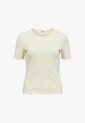 Kermansävyinen, lyhythihainen ribbineulottu paita, jossa hillityt pystykoristeet, pyöreä pääntie ja röyhelöidyt reunat hihoissa ja helmassa.