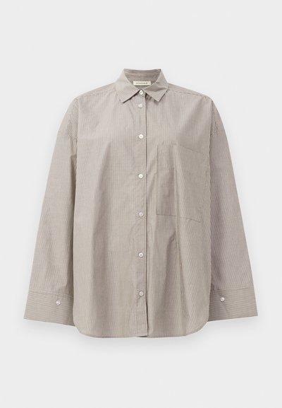 Striped button-up shirt in beige and white, featuring a pointed collar, long sleeves, front pocket, and a relaxed fit.