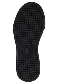 Black rubber outsole with a textured, patterned surface. Features a prominent DC logo in the center. Flat design for traction.