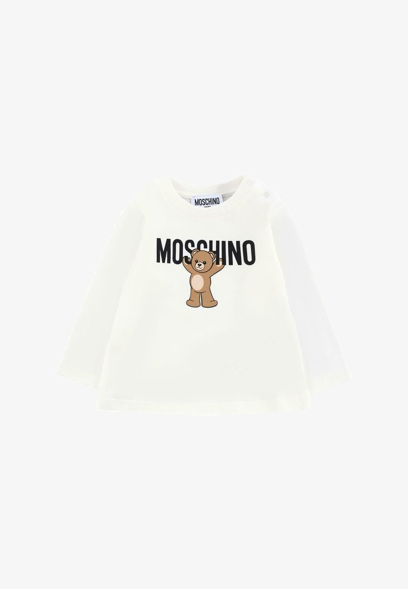 Camicia bianca a maniche lunghe con grafiche di orso bruno e testo "MOSCHINO" in nero. Materiale in cotone morbido con bottoni sulla spalla.