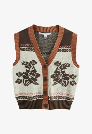 Ærmeløs strikket vest med brune blomsterprint, rust-orange ribkant, fire sorte knapper og dekorative syninger på creme- og brun baggrund.