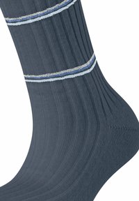 Calze a coste blu scuro con strisce orizzontali in blu chiaro e argento a contrasto. Presentano una forma aderente e una trama liscia.