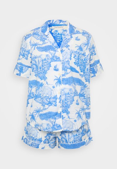 Σετ πιτζάμας κοντομάνικο με λευκό φόντο και μπλε ελέφαντες καθώς και τροπικά σχέδια. Φτιαγμένο από ελαφρύ ύφασμα, με κουμπί κλεισίματος.