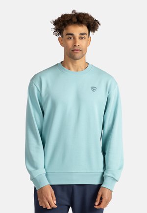 Felpa girocollo azzurro chiaro in morbido tessuto, con polsini e orlo a costine, con un piccolo logo sul petto.