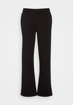 Sorte joggebukser med en avslappet passform, elastisk midjebånd og snøring. Laget av mykt stoff med en glatt tekstur og uten mønster.