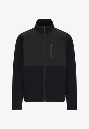 Svart fleecejakke med høy krage, kontrasterende teksturert stoff, frontglidelås og én glidelåslomme på brystet. Jevn tekstur og enkelt design.
