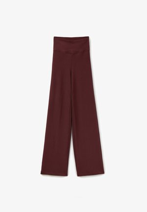 Wide-leg pants in a deep burgundy color, made from a soft, stretchy fabric with a ribbed texture and a high, fitted waistband.