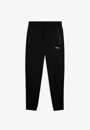 Pantaloni della tuta neri a sigaretta con cintura elastica, cordino, tasche laterali con zip e logo "FREDDY" bianco sulla coscia destra.