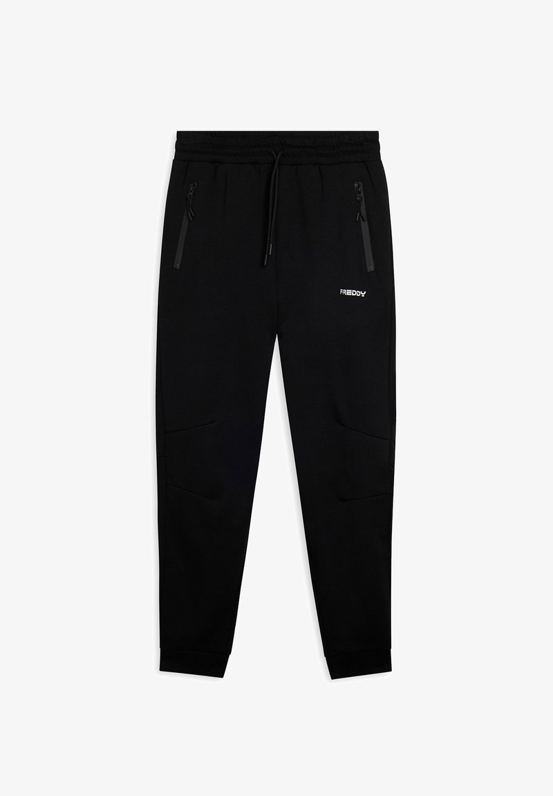 Pantaloni della tuta neri a sigaretta con cintura elastica, cordino, tasche laterali con zip e logo "FREDDY" bianco sulla coscia destra.