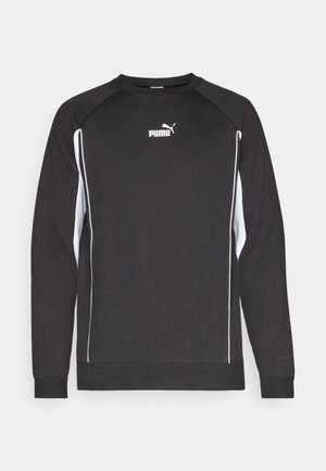 Sweatshirt preto de mangas longas, com detalhes brancos nas laterais e gola redonda. Apresenta um pequeno logo branco da Puma no peito.