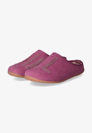 Purple fabric slip-on shoes with a textured surface, featuring contrasting pink suede accents forming large letters on the front and a rubber sole.