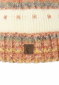 Knit beanie hat featuring a cream top with textured patterns, and a ribbed, multicolored band in peach and yellow tones with a leather label.