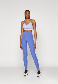 Under Armour Leggingek - starlight/celeste