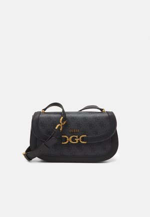 Black Guess crossbody bag with patterned surface, gold logo clasp, and adjustable strap on plain white background.