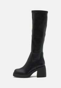 Black knee-high boots made of smooth leather, featuring a chunky block heel, rounded toe, and minimalist design with no visible embellishments.