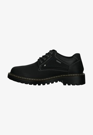 Zwarte leren veterschoenen met contrasterende stiksels, een gewatteerde kraag en een robuuste rubberen zool met diepe noppen voor grip.