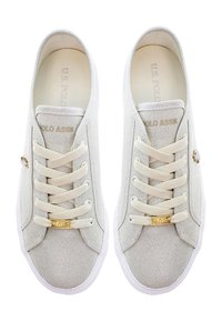 Pair of light beige casual lace-up sneakers with white soles and gold-tone accents, viewed from above.