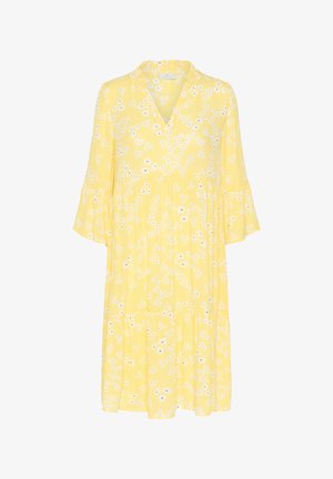 Sárga ruha V nyakkivágással, lebegő ujjakra és réteges aljára. Fehér virágmintával rendelkezik, kicsi fekete részletekkel. Könnyű anyag.