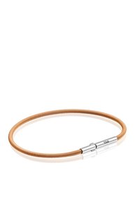 Bracciale flessibile in oro rosa con una texture metallica liscia. Presenta un gancio in argento con il marchio "TOUS". Design semplice e circolare.
