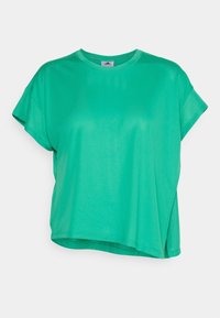 Grön sporttop med kort ärm i meshmaterial, löst snitt och rund halsringning, med subtila sidsprickor för ökad andningsförmåga.