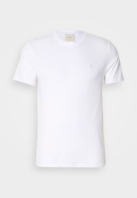 T-shirt en coton blanc uni à manches courtes avec col rond et petit logo "CK" discret sur la poitrine gauche.