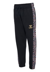 Schwarze Jogginghosen mit einem elastischen Bund, die an den Seiten mit einem bunten Tierdruck akzentuiert sind und ein goldenes Logo an der Hüfte aufweisen.