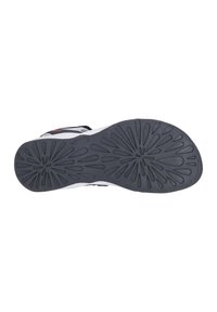 Rubber shoe sole with a black texture, featuring a floral tread pattern and a white edge. Durable design suitable for various surfaces.