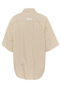 Beige short-sleeve shirt with white vertical stripes, featuring a button-down collar and a brand label at the back. Rounded hem at sides.