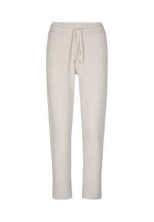 Pantaloni sportivi di un leggero beige, realizzati in un materiale morbido. Presentano una vita elastica con cordoncino e un dettaglio con logo sul lato. Design con gamba a sigaretta.