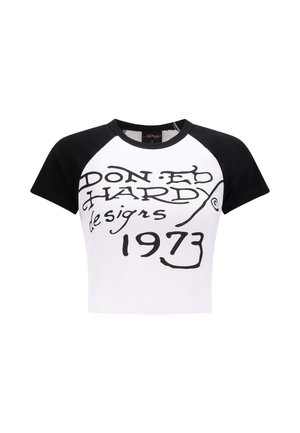 Crop top a maniche corte in bianco e nero, con una grande stampa grafica nera con testo in corsivo e l’anno "1973". Tessuto misto cotone.