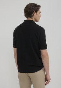 Calliope OPERATO  - Polo - nero