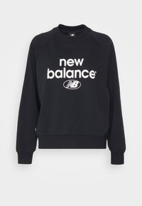 Mustapaita, jossa on ribattuja hihansuita ja helmaa, ja jonka etupuolella on valkoinen "new balance" -logo ja emblem. Pehmeää kangasta, klassinen malli.