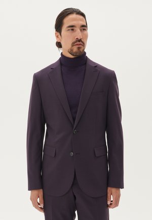 Purple suit jacket with notch lapels and two front pockets, paired with a matching purple turtleneck, smooth texture, and tailored fit.