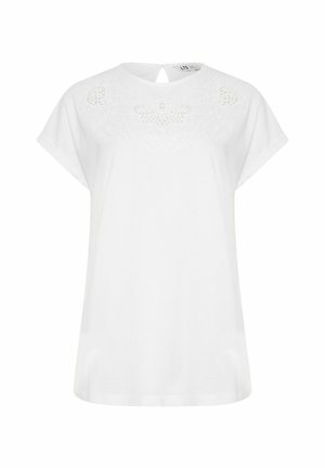Blouse blanche à manches courtes avec encolure ronde et délicate broderie florale près du col, dotée d'une petite ouverture en forme de goutte au dos avec un bouton.