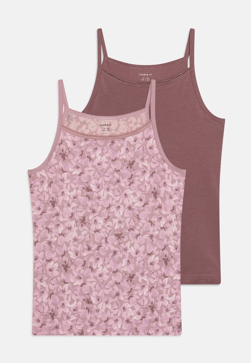 Due canotte: una di color mauve uniforme e l'altra con un leggero motivo floreale rosa, caratterizzate da spalline sottili e una consistenza morbida e liscia.