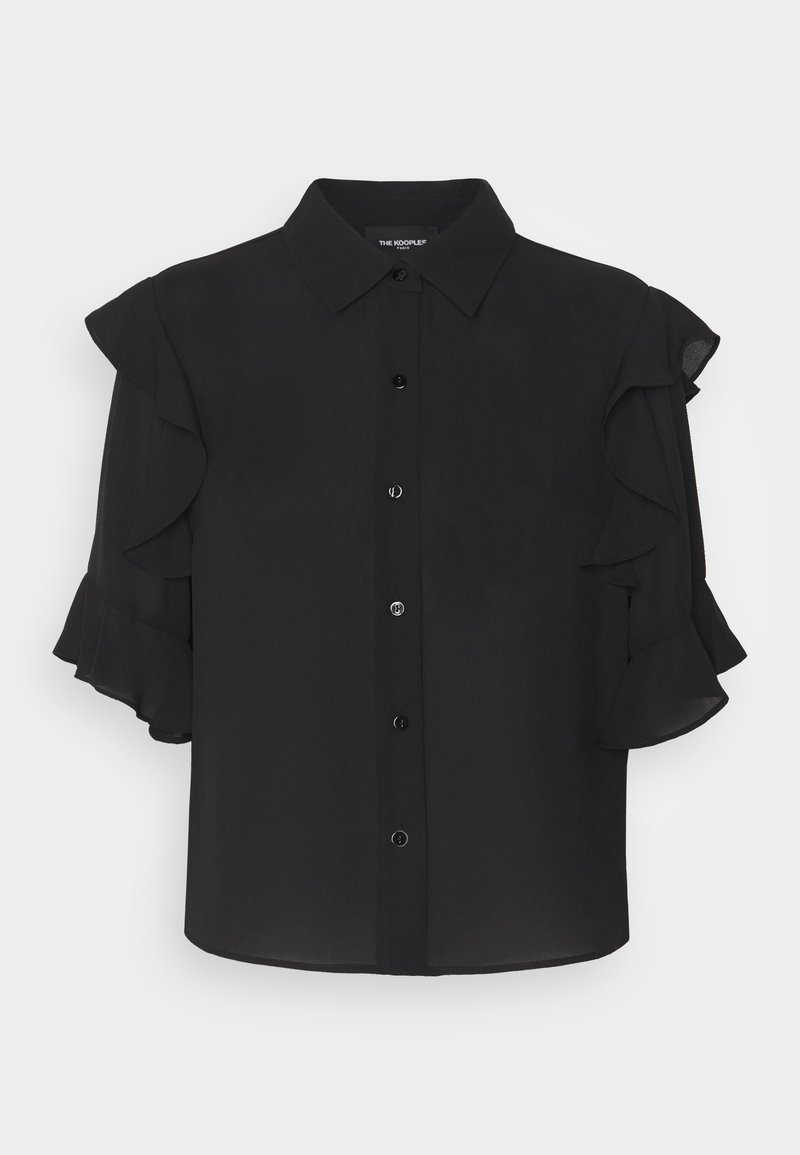 Blouse noire boutonnée avec manches courtes à volants et col classique, présentée sur un fond clair uni.
