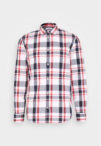 Camicia a maniche lunghe con bottoni, in motivo a quadri bianco, rosso e blu navy; presenta un colletto, chiusure con bottoni e un logo sul petto.